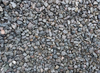 Rough gray crushed stone surface texture
